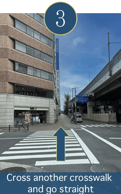 Cross the next crosswalk and go straight